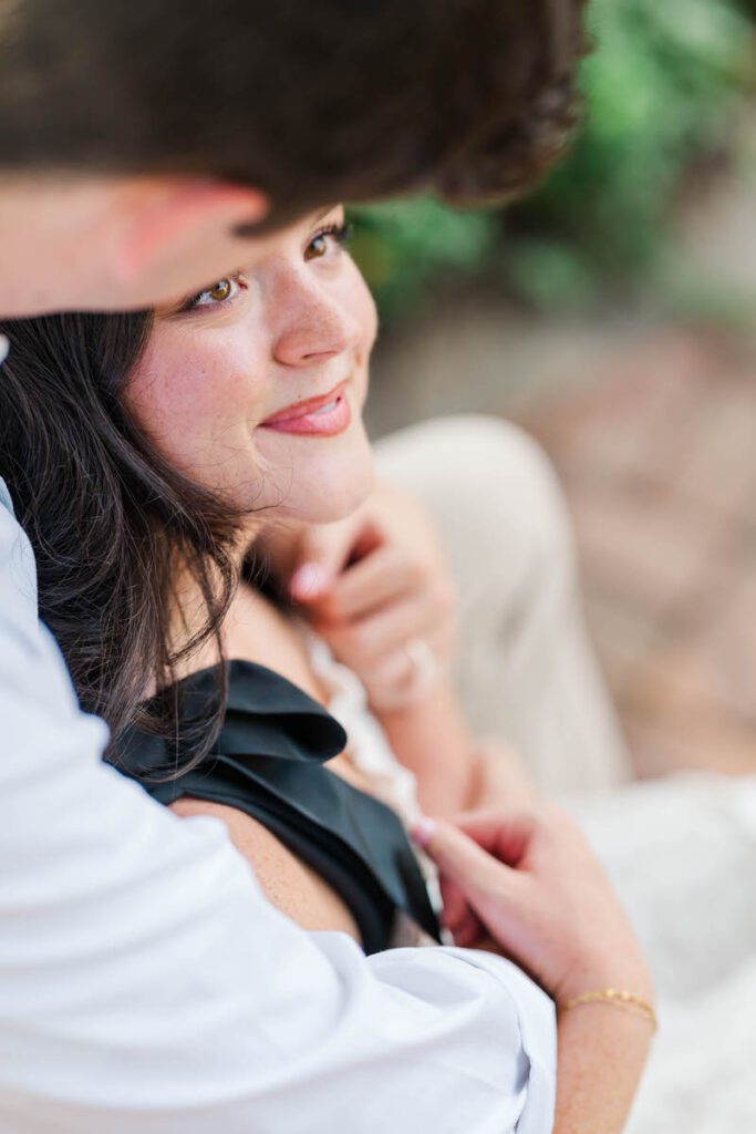 Couple smile at each other at Anchorage Trail during their engagement session in Louisville, KY