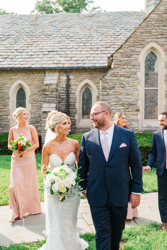 Newlyweds celebrate with their bridal party at Duncan Memorial Chapel