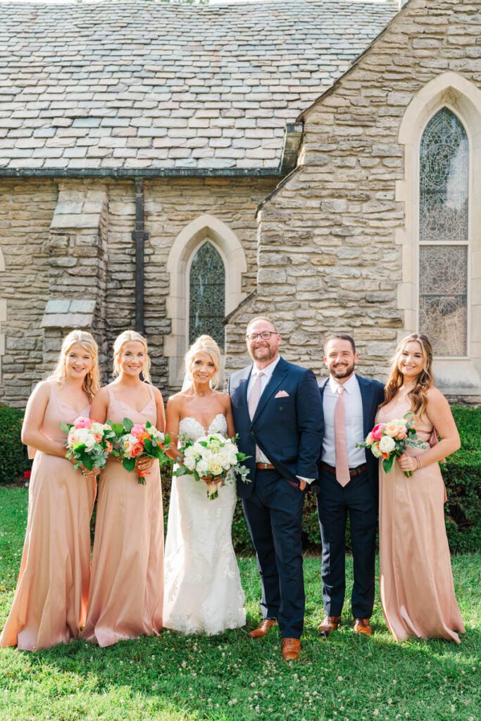 Newlyweds celebrate with their bridal party at Duncan Memorial Chapel