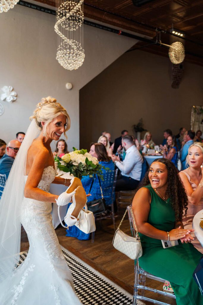Bride and groom walk into their wedding reception at The Gatewood in La Grange