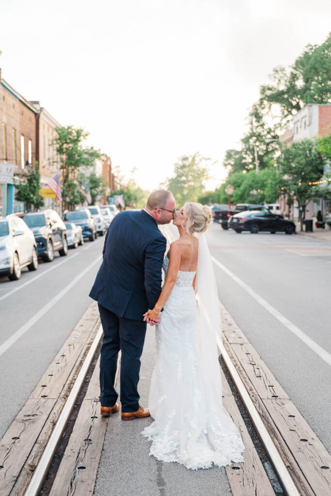 Newlyweds share a kiss outside of The Gatewood in downtown La Grange