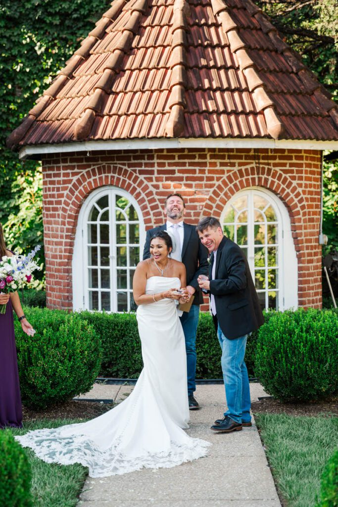 Bride and groom laugh during their wedding ceremony at Castle and Key