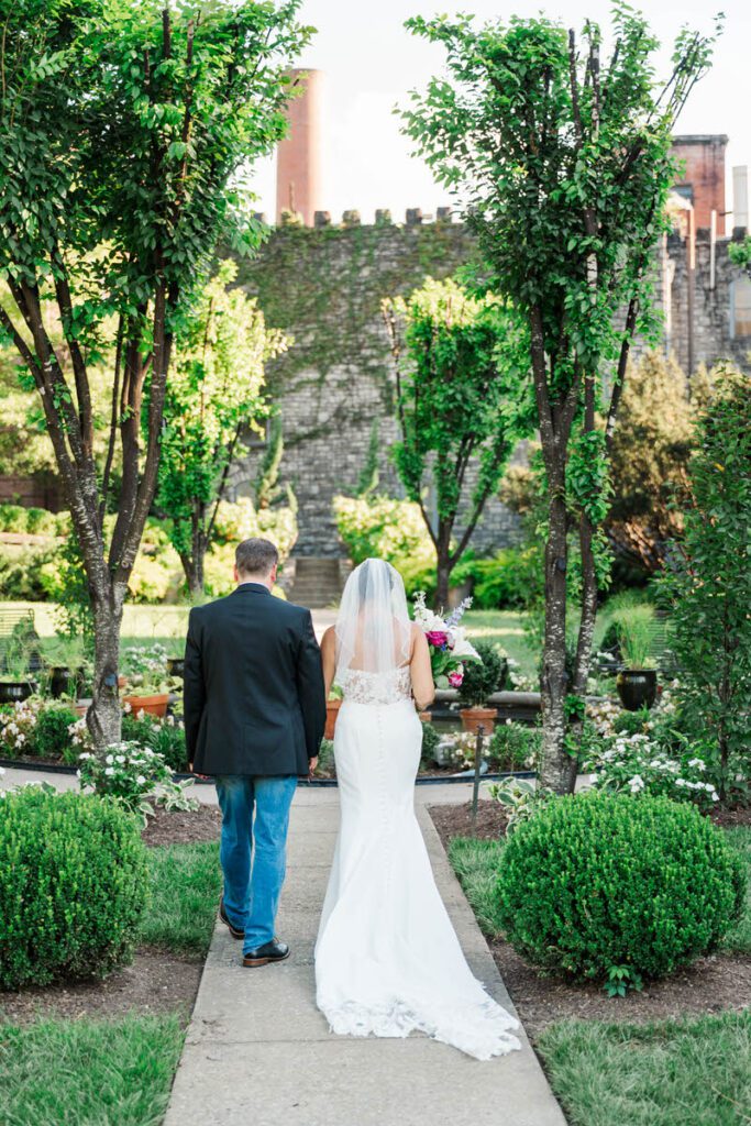 Bride and groom celebrate walking down the aisle at Castle and Key