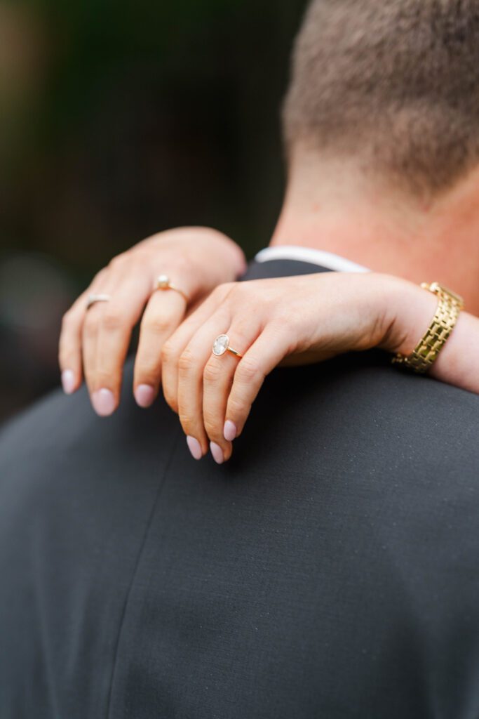 Couple shows off their ring at their Saint James Court engagement session.