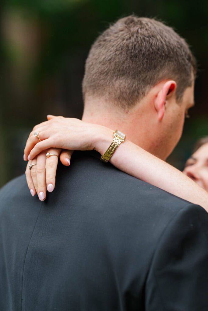 Couple shows off their ring at their Saint James Court engagement session.