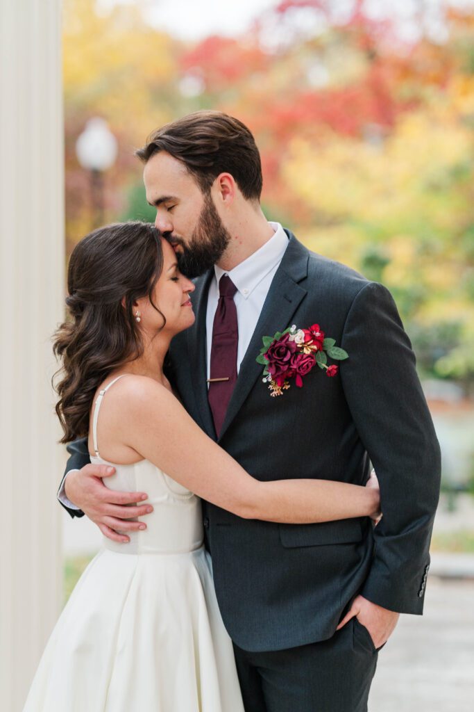 Bride and groom share a kiss at The Bell House for their Lexington wedding day.