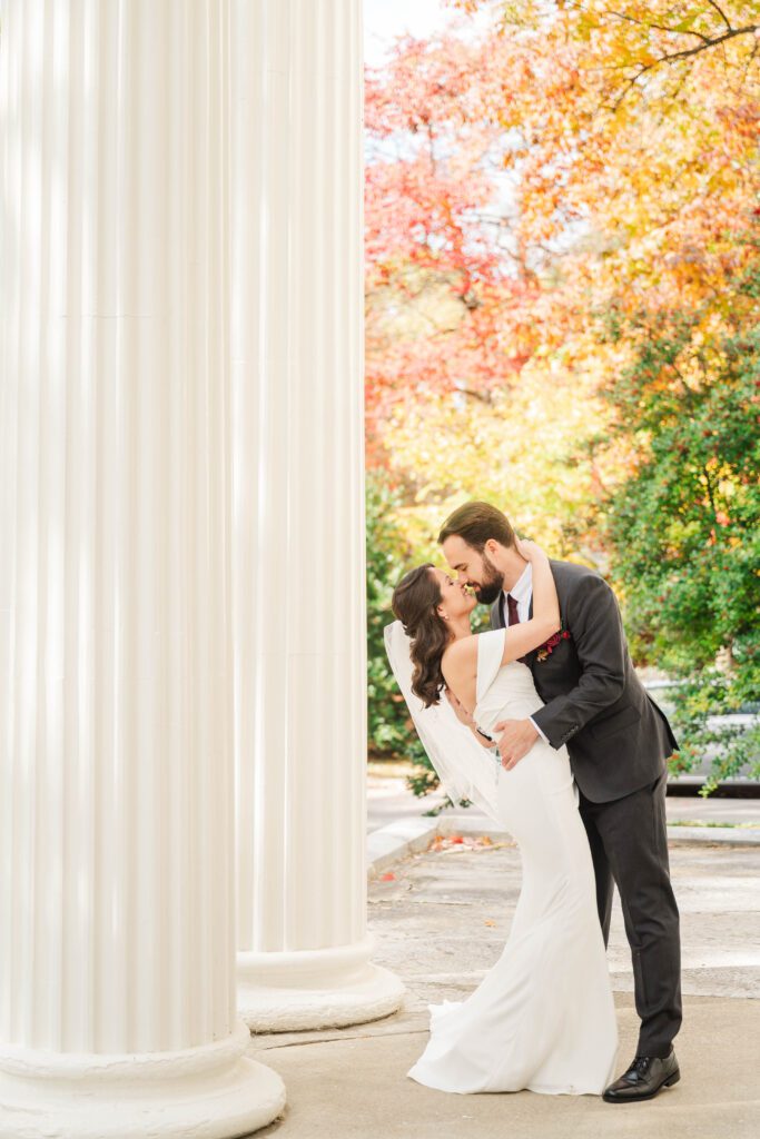Bride and groom share a kiss at The Bell House for their Lexington wedding day.