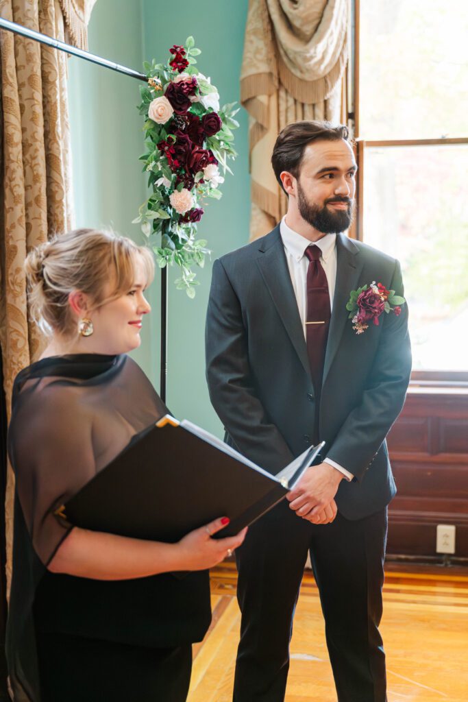 Groom watches his bride walk down the aisle on his wedding day at The Bell House in Lexington