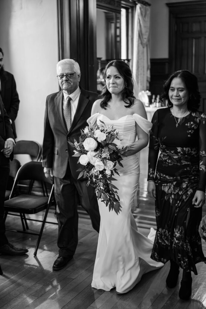 Bride walks down the aisle on her wedding day at The Bell House in Lexington