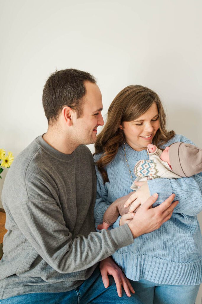 A new family snuggles up together.