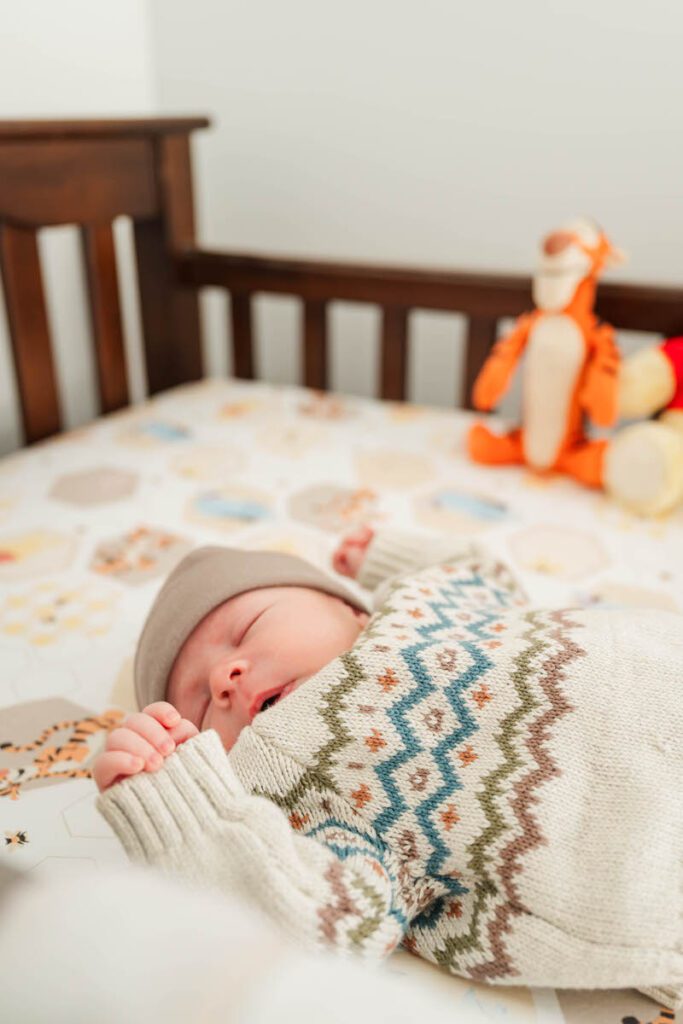 A baby boy sleeps soundly during his newborn session.