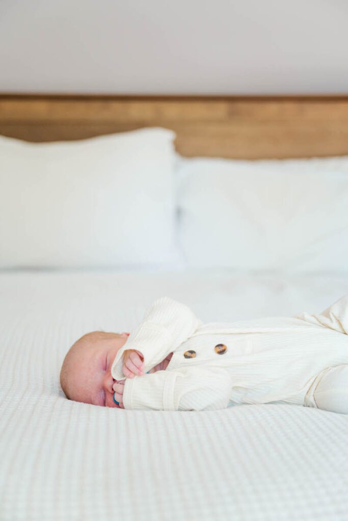 A newborn sleeps peacefully on his parents' bed. 

Louisville In-Home Newborn Photographer

Michelle Bordenkircher Photography.
