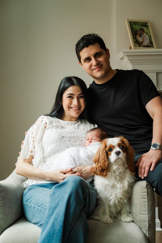 A mom and dad poses with their newborn and dog. 

Louisville In-Home Newborn Photographer

Michelle Bordenkircher Photography