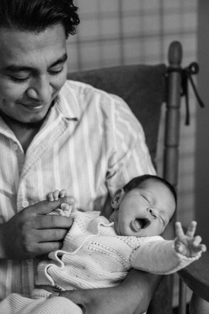 A father proudly looks at his newborn child. 

Louisville In-Home Newborn Photographer

Michelle Bordenkircher Photography