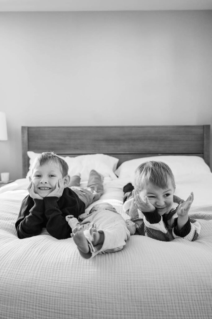 Two older boys lay near their newborn sibling. 

Louisville In-Home Newborn Photographer

Michelle Bordenkircher Photography