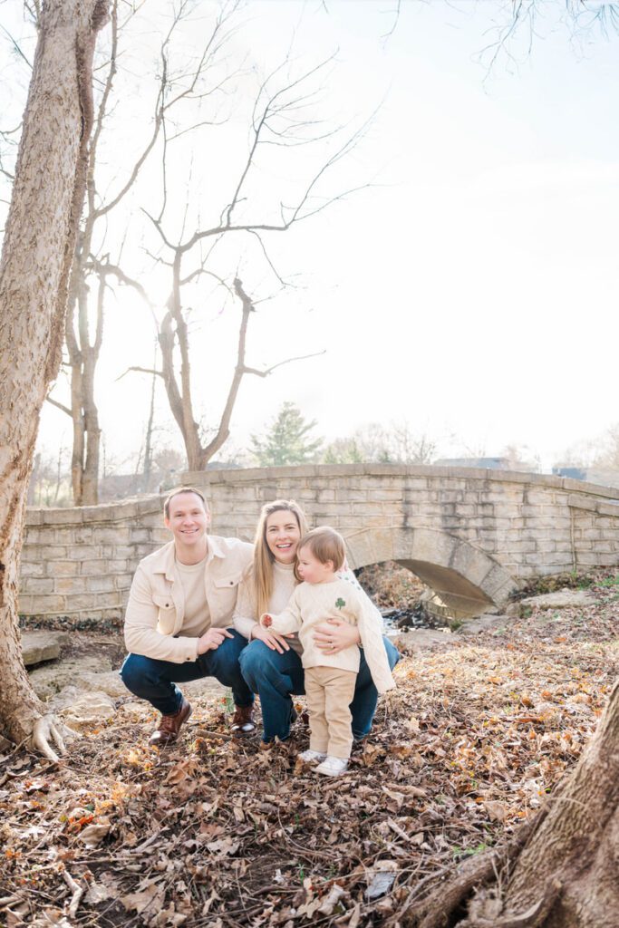 A mom and dad pose with their toddler during their family session at Anchorage Trail in Louisville, KY

Photos by Michelle Bordenkircher Photography