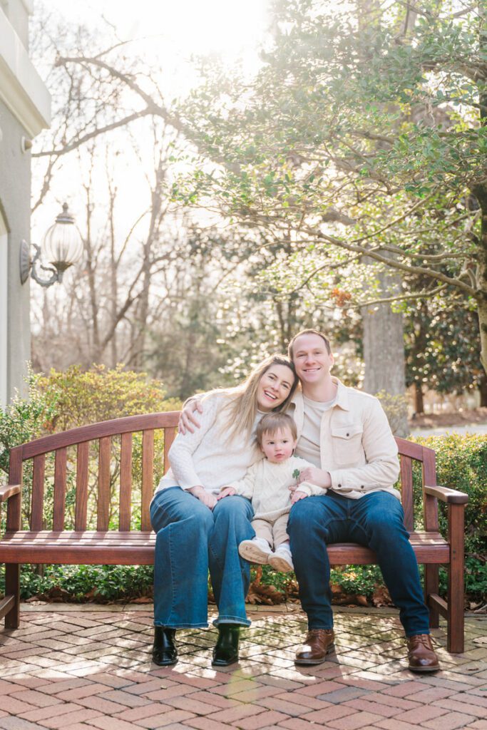 A mom and dad pose with their toddler during their family session at Anchorage Trail in Louisville, KY

Photos by Michelle Bordenkircher Photography