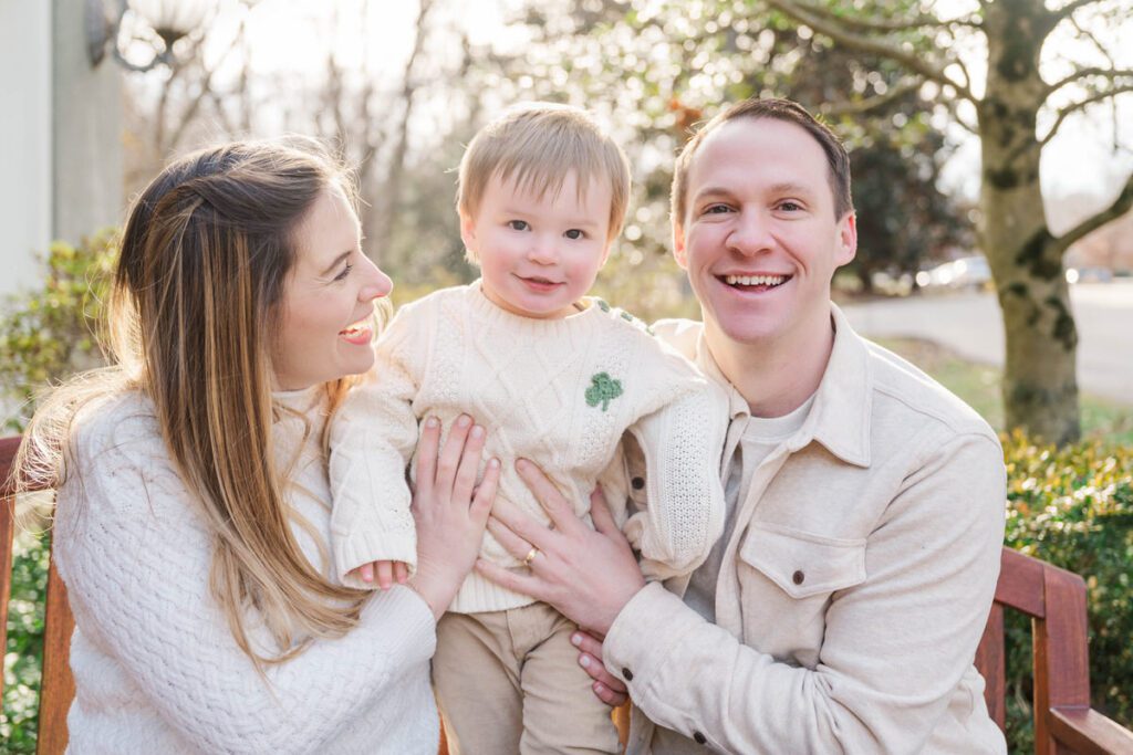 A family poses for a photo while sitting on a bench during their family session at Anchorage Trail in Louisville, KY

Photos by Michelle Bordenkircher Photography