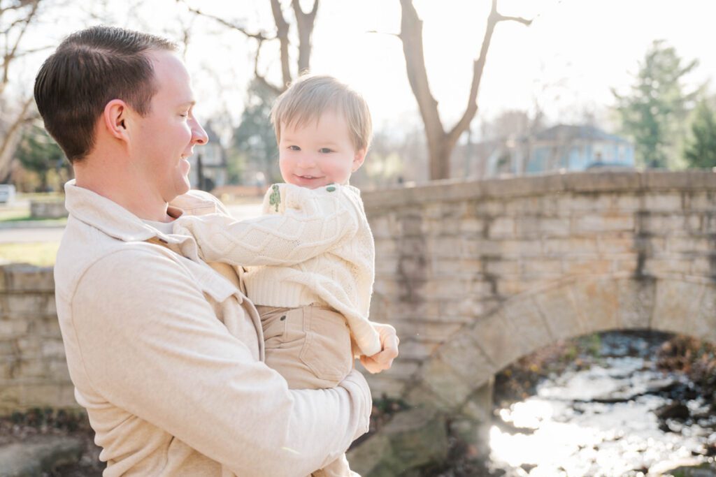 A dad holds his smiling toddler during a family session at Anchorage Trail in Louisville, KY

Photos by Michelle Bordenkircher Photography