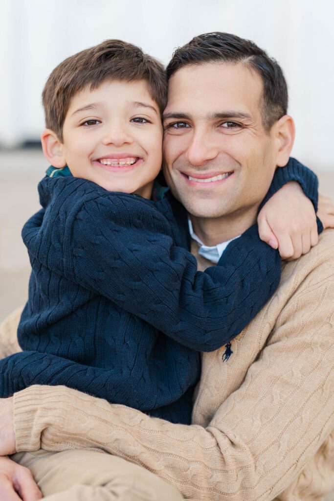 A boy hugs his dad during a winter family session.

Photos by Michelle Bordenkircher Photography