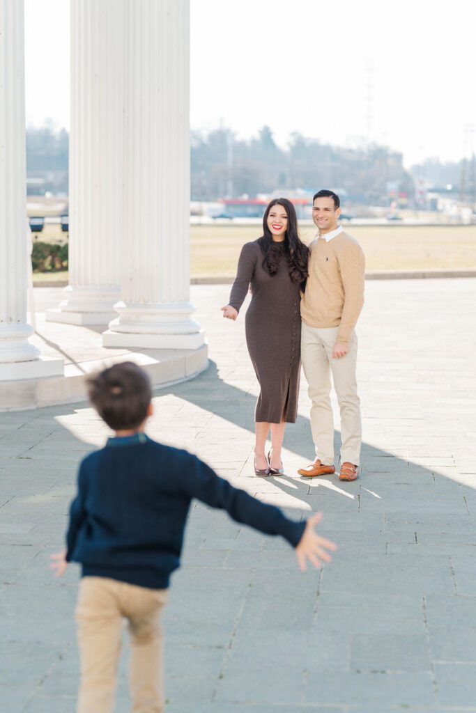 A boy runs toward his parents during their winter family session at the Louisville Water Tower

Photos by Michelle Bordenkircher Photography