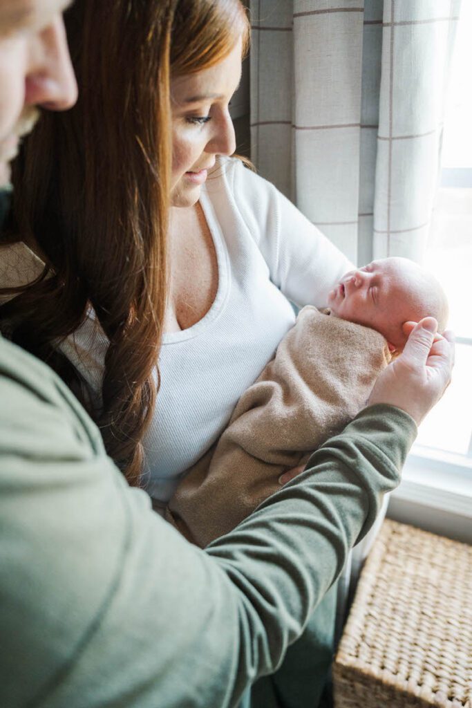 A mom and dad snuggle their sweet baby during their Louisville In-Home newborn session

Photos by Michelle Bordenkircher Photography